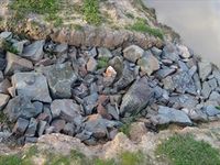 Rocks in the spill way on the wet lands , good habitat for frogs